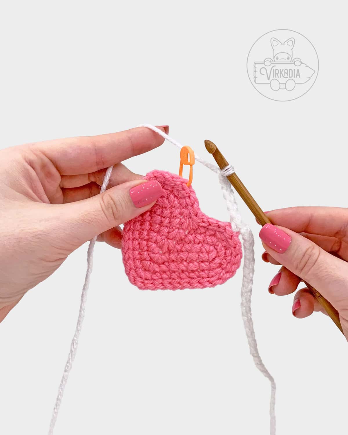 free crochet heart garland pattern tutorial of how to attach the motif onto the garland