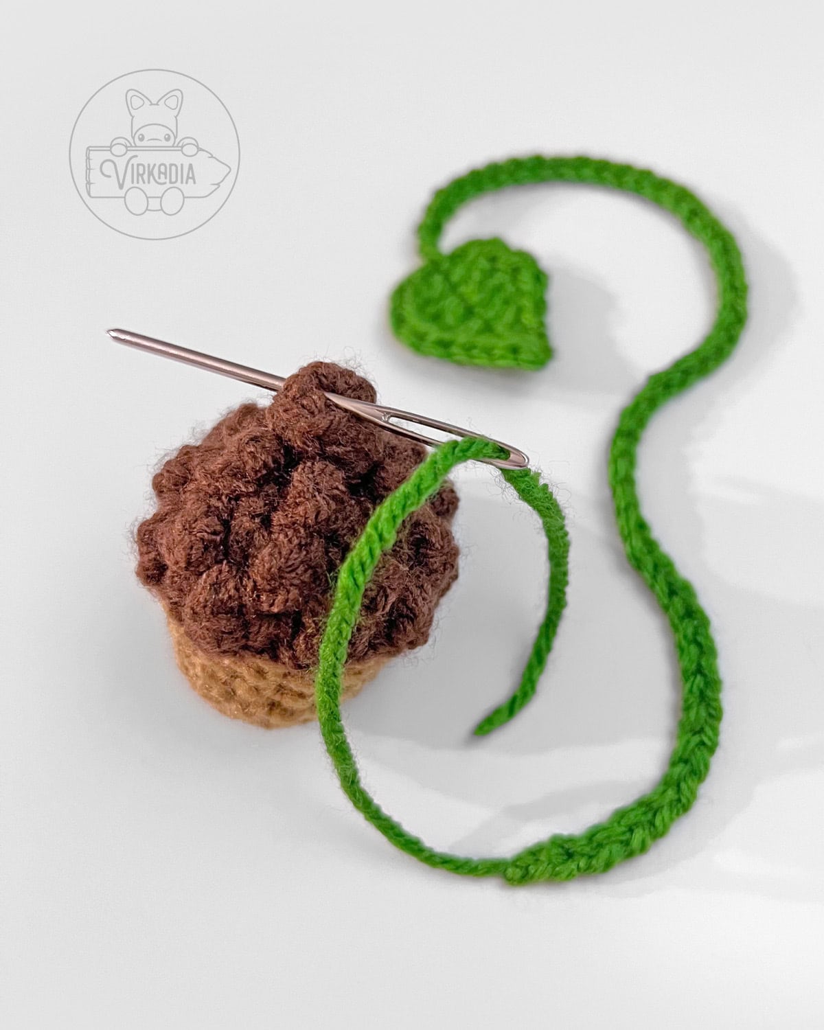 how to sew the leaf string into the top of your mini crochet acorn bookmark