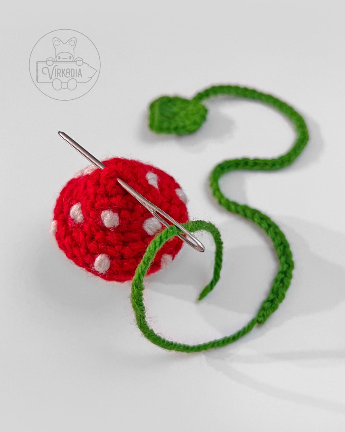 how to sew the leaf string into the top of your mini crochet mushroom bookmark
