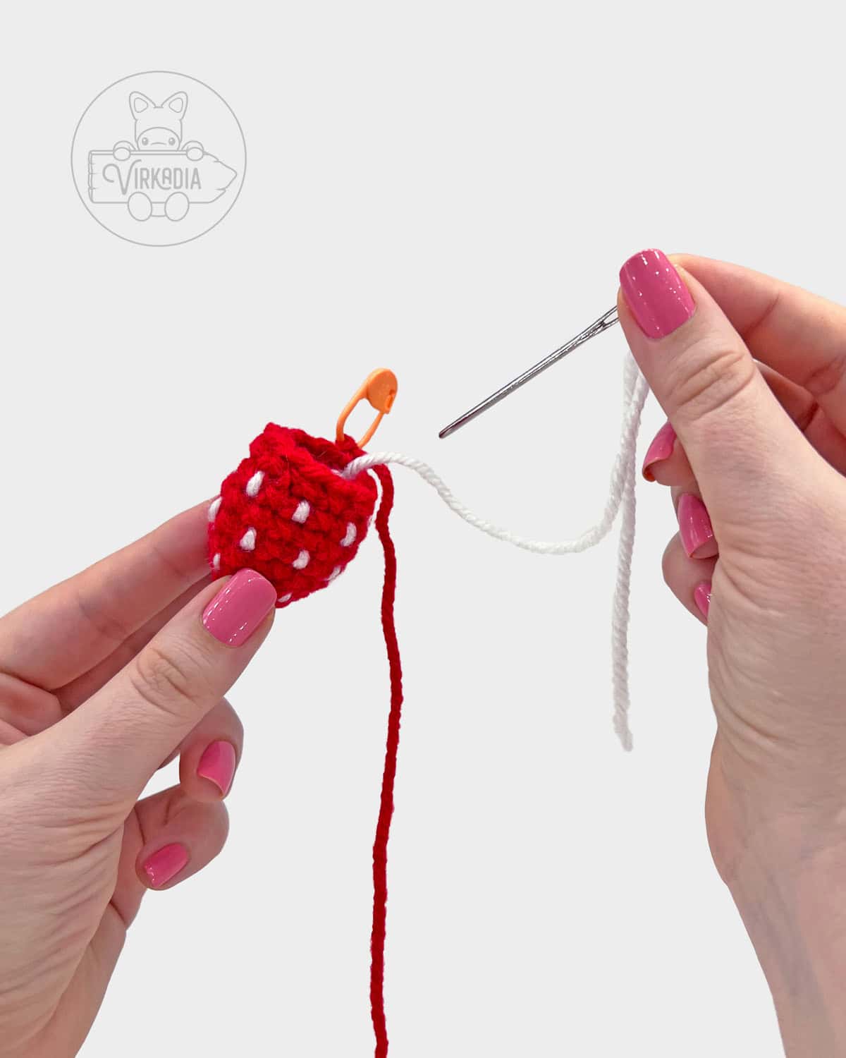 free bookmark pattern tutorial of how to embroider the seeds onto the fruit