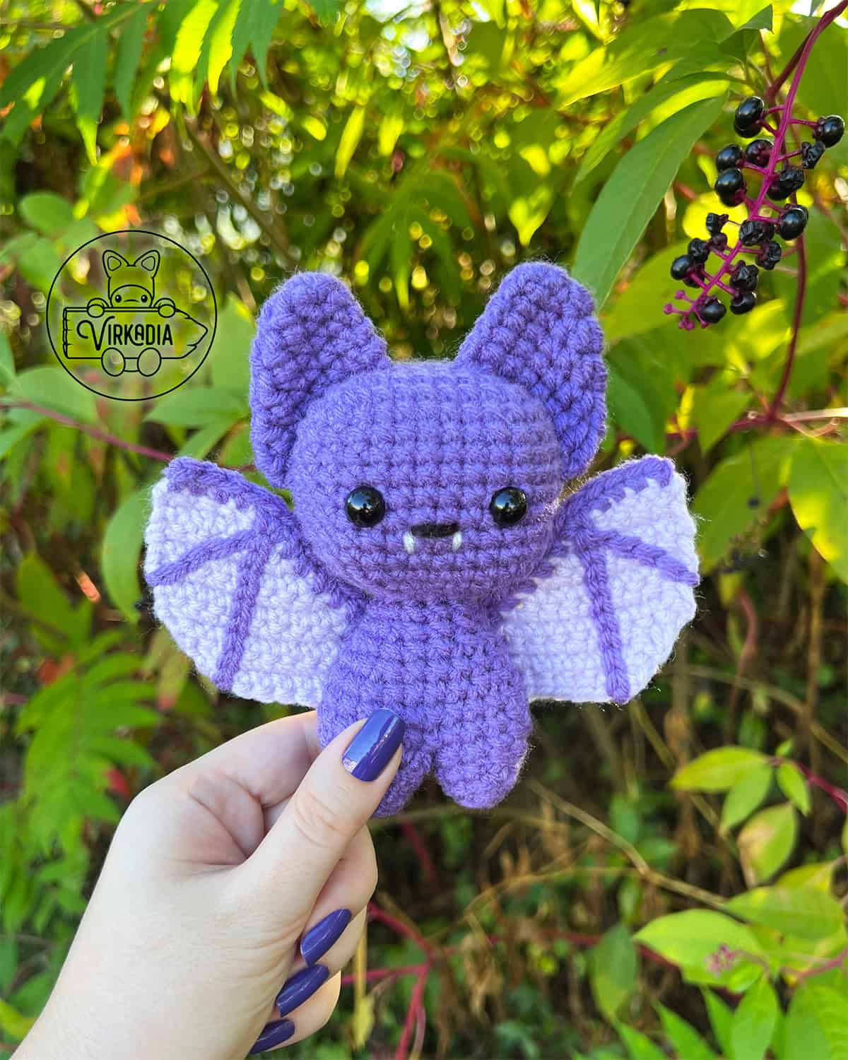candid shot of free crochet bat amigurumi plushie for Halloween decorations, spooky home decor, fall crafts, and DIY animal gifts