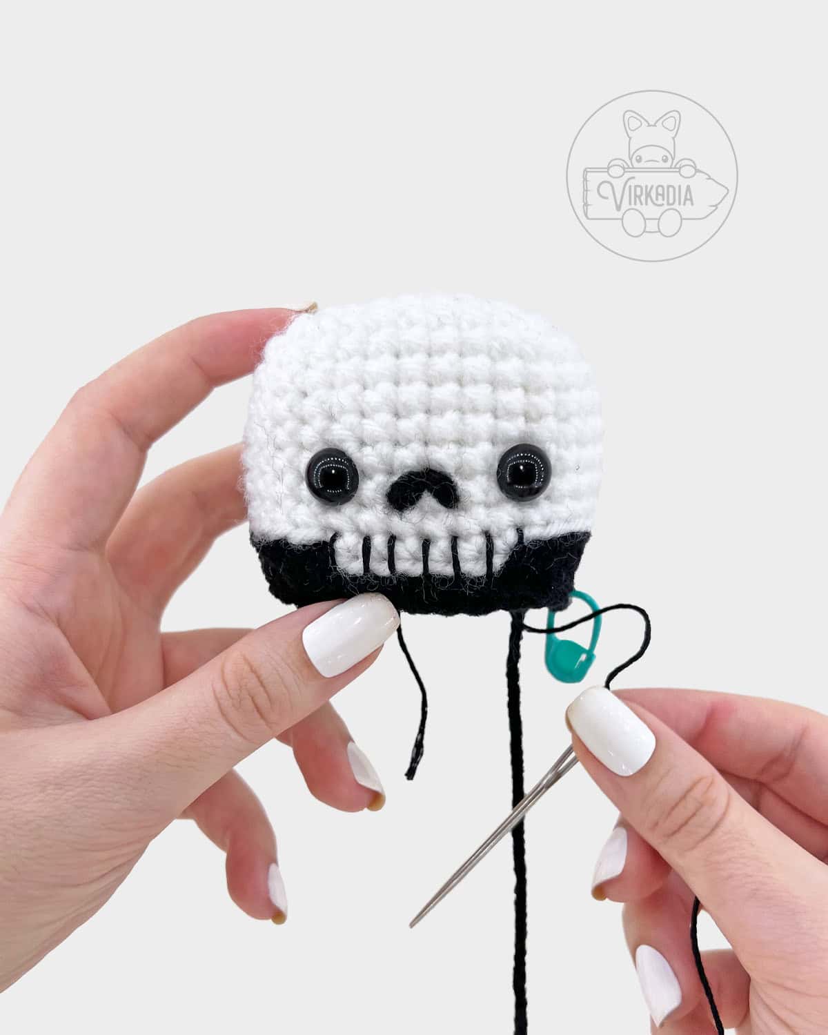 crochet grim reaper amigurumi pattern tutorial of how to embroider the teeth onto the face
