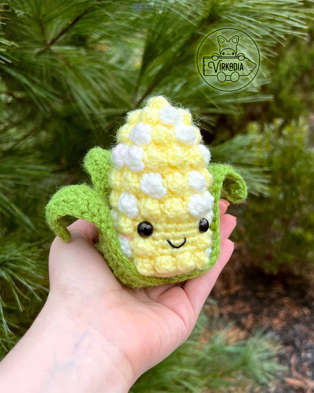 candid shot of free crochet corn amigurumi plushie for Thanksgiving decorations, DIY fall decor, and handmade gifts