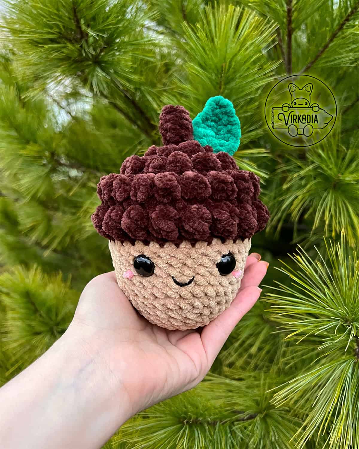 candid shot of free crochet acorn amigurumi plushie in chunky yarn for DIY fall decor, cottagecore style, and handmade gifts