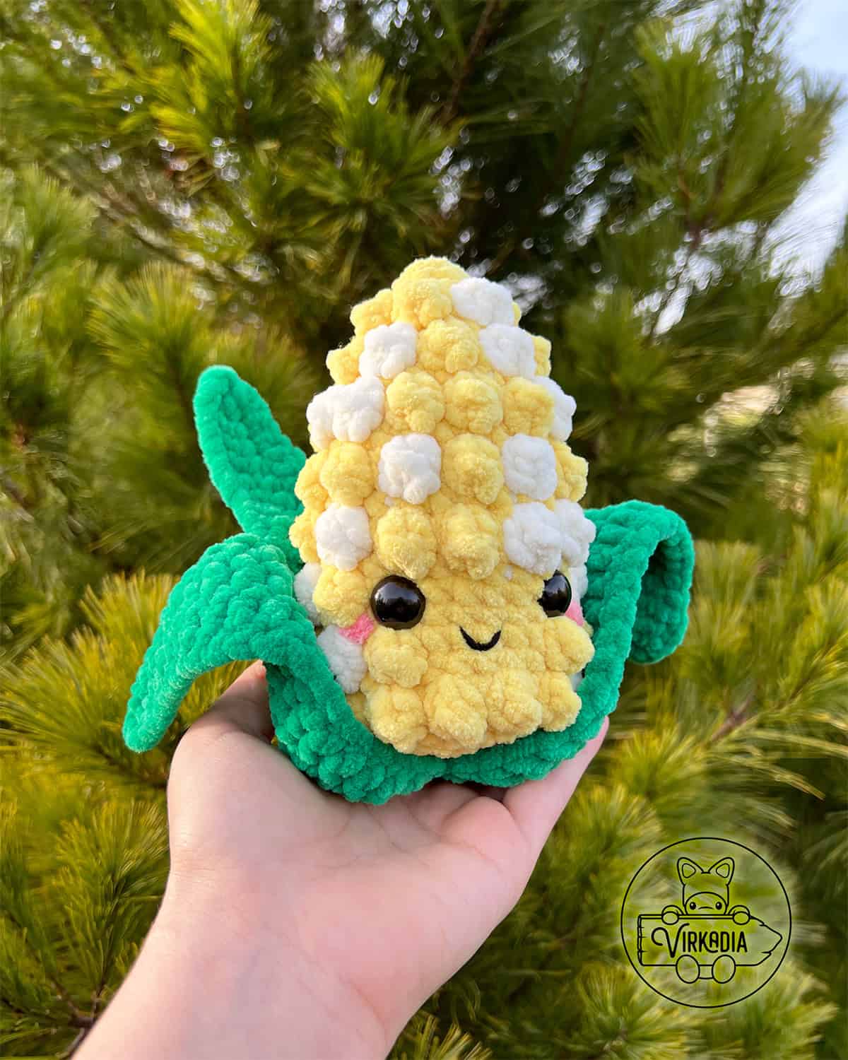 candid shot of free crochet corn amigurumi plushie in chunky yarn for Thanksgiving decorations, DIY fall decor, and handmade gifts