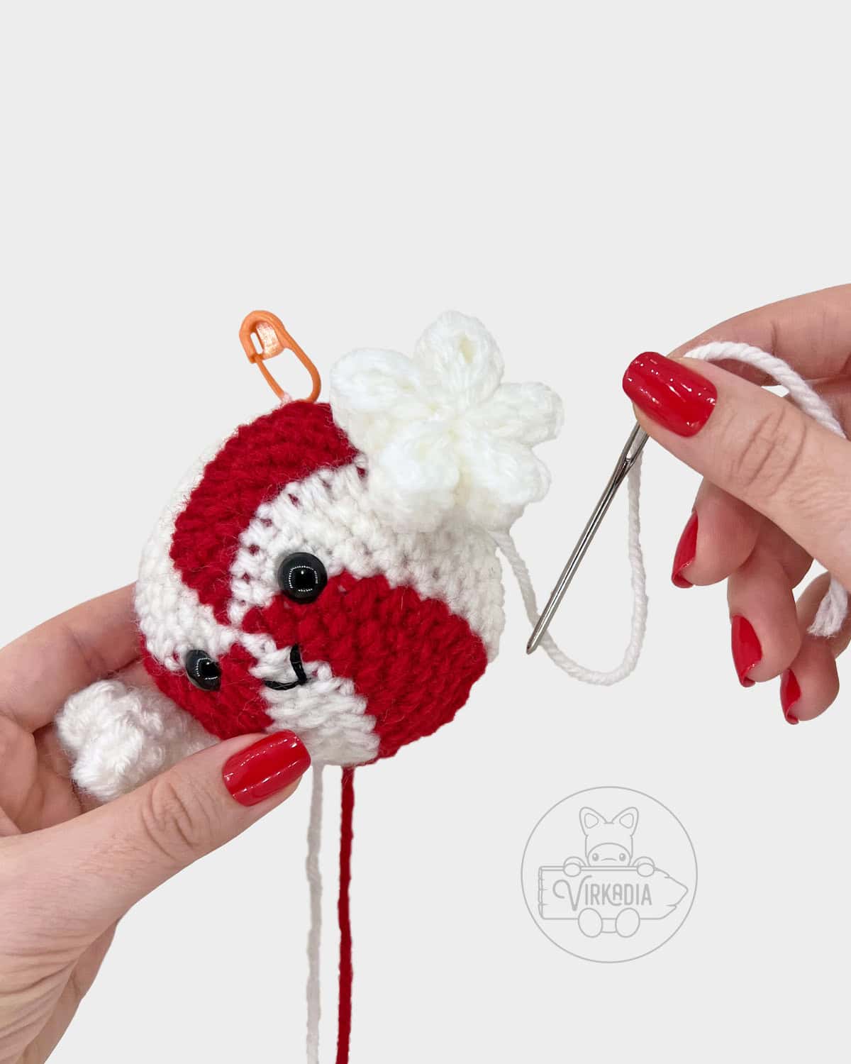 free crochet peppermint candy amigurumi pattern tutorial of how to sew the twists onto the candy