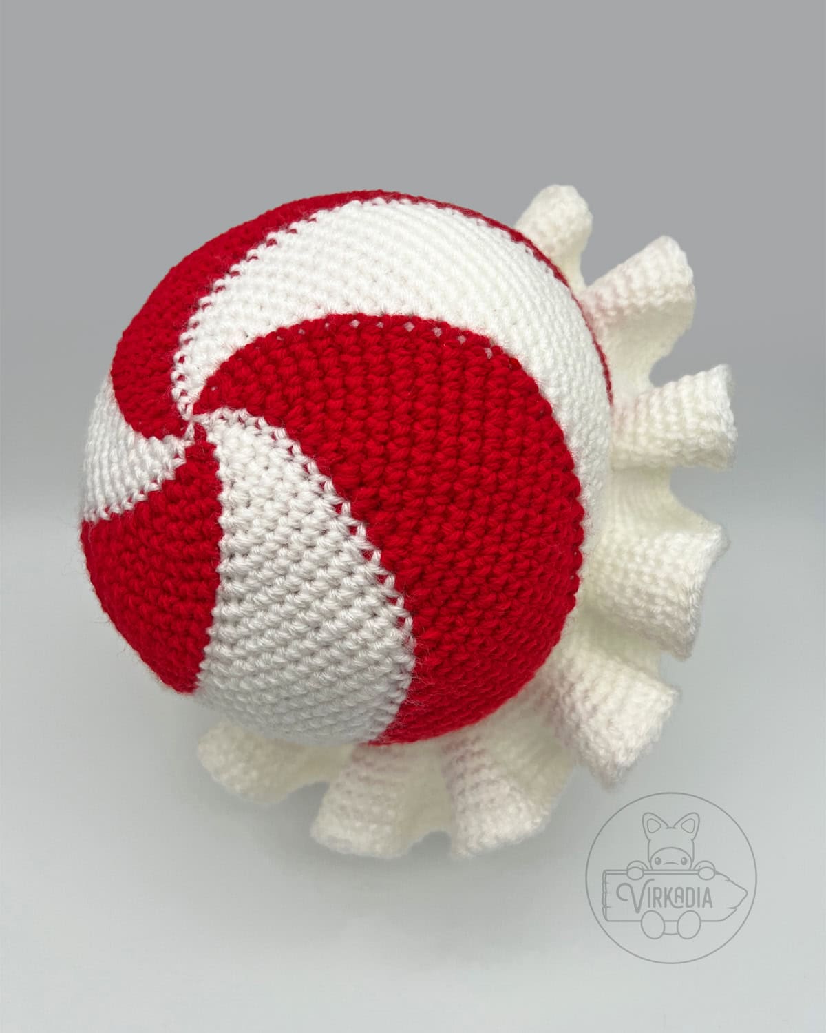 top view of crochet peppermint hat for Christmas accessories, DIY holiday clothing, winter crafts, and handmade gifts