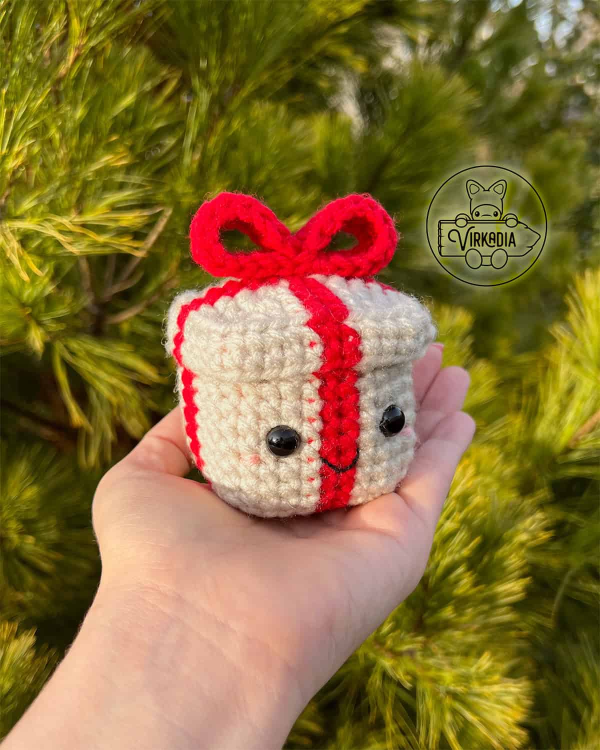 candid shot of crochet gift box amigurumi plushie for Christmas decorations, DIY winter decor, and handmade holiday gifts