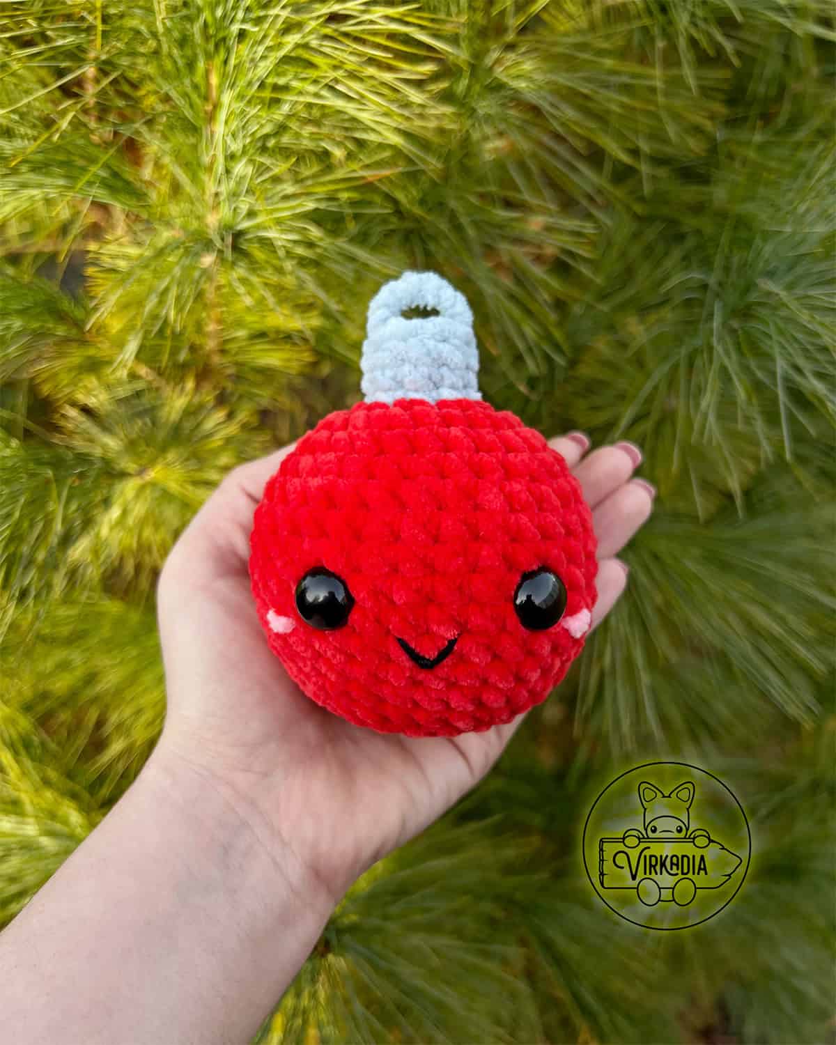 candid shot of crochet ornament amigurumi plushie in chunky yarn for Christmas decorations, DIY winter decor, and handmade holiday gifts