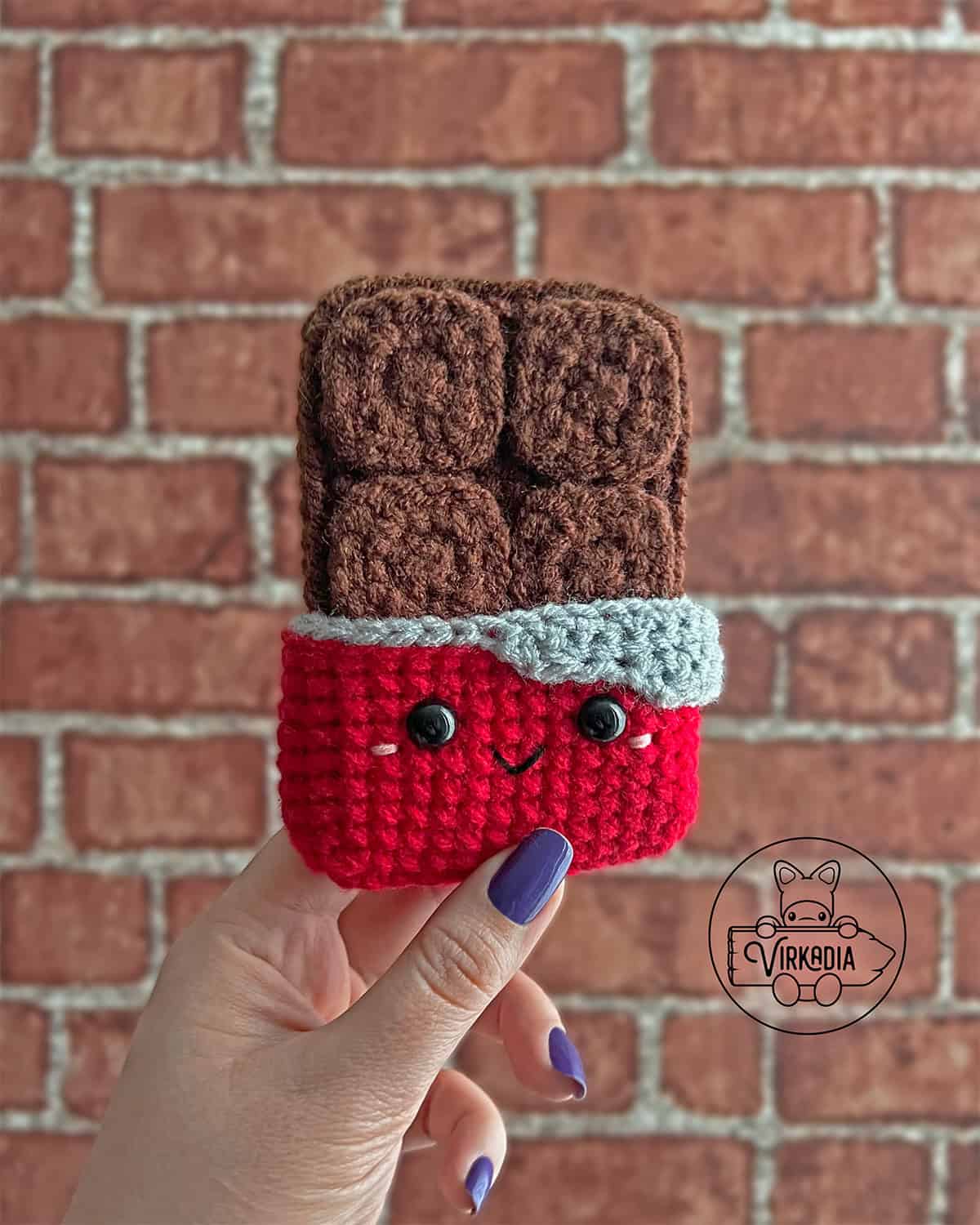 candid shot of crochet chocolate bar amigurumi plushie for Valentine's Day decorations, DIY holiday decor, and handmade romantic gifts