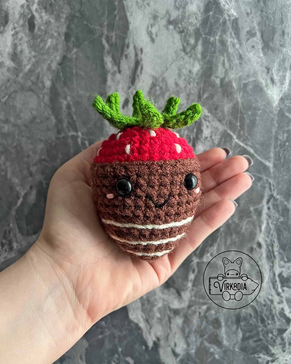 candid shot of crochet chocolate strawberry amigurumi plushie for Valentine's Day decorations, DIY holiday decor, and handmade romantic gifts