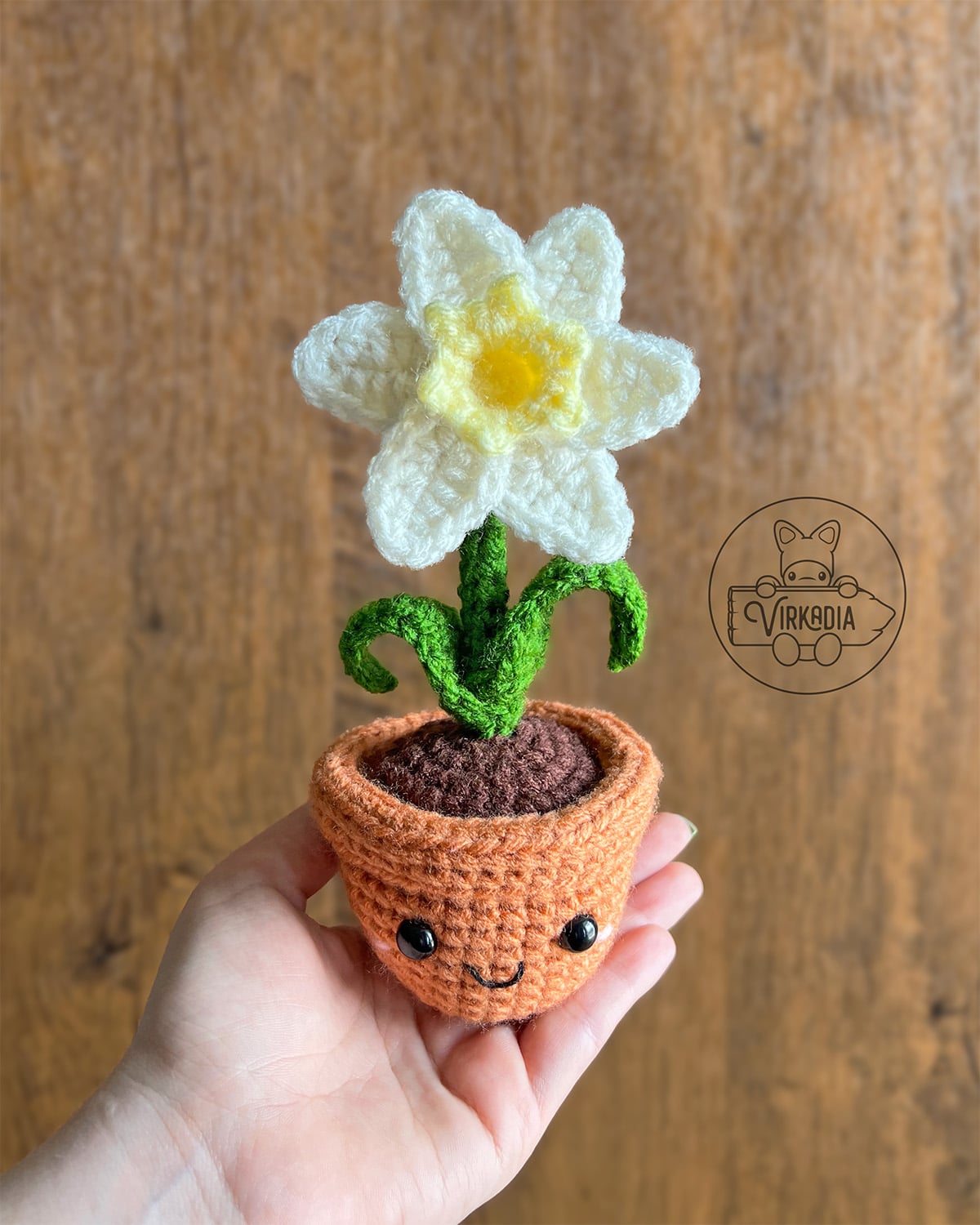 candid shot of free crochet daffodil amigurumi plushie for DIY gifts, spring crafts, and plant decor