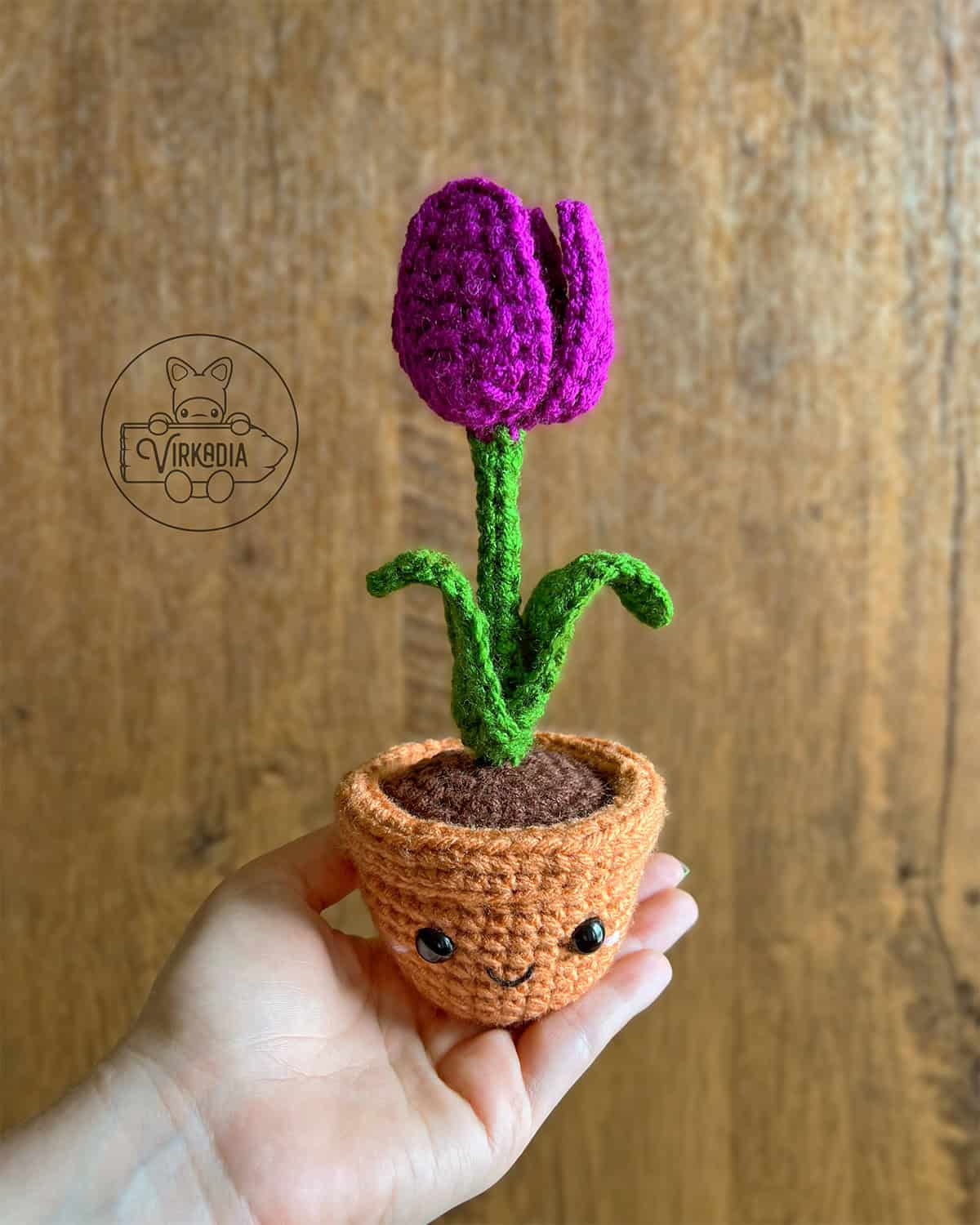 candid shot of free crochet tulip amigurumi plushie for DIY gifts, spring crafts, and plant decor