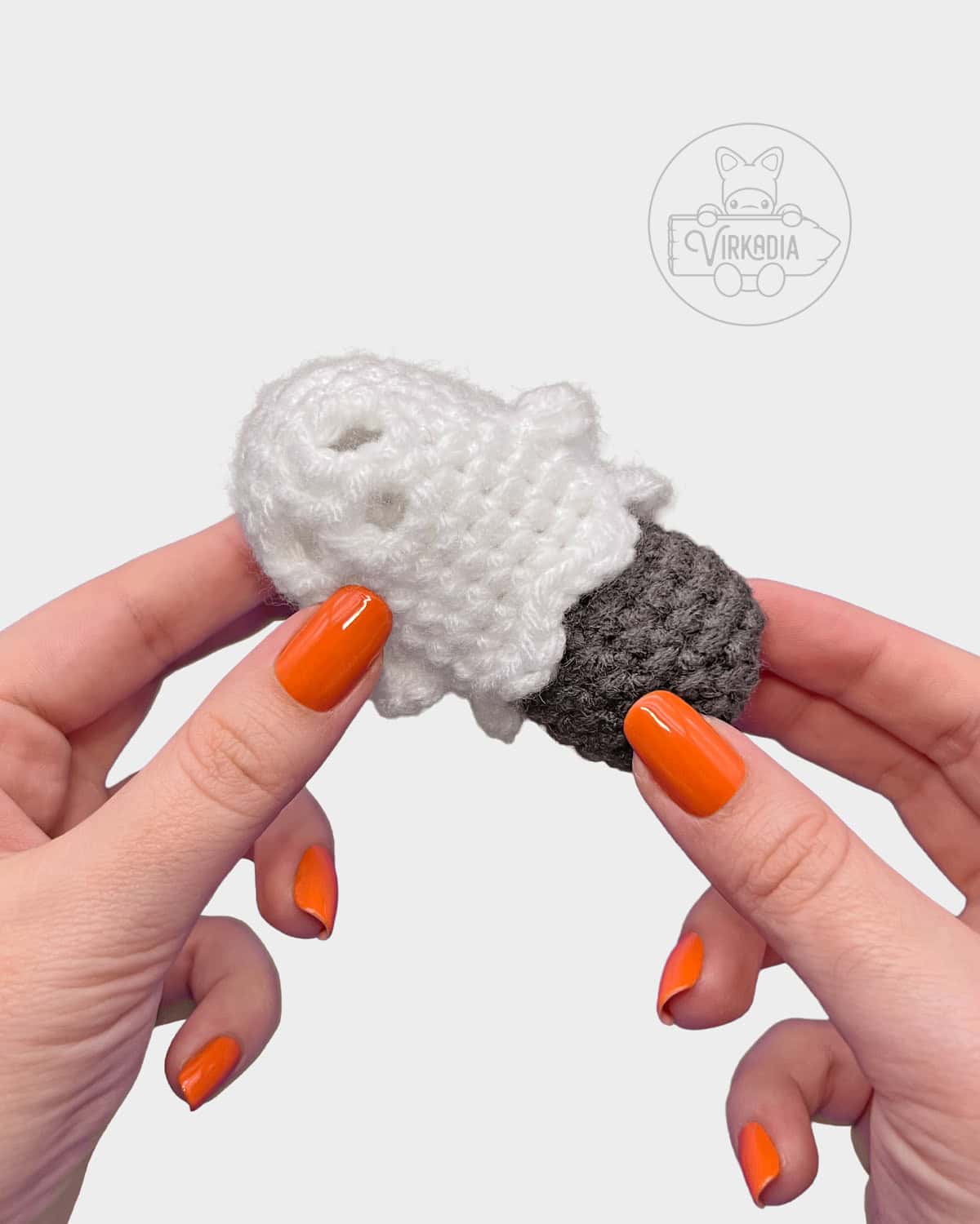 free crochet ghost keychain tutorial of how to insert the inner piece into the ghost