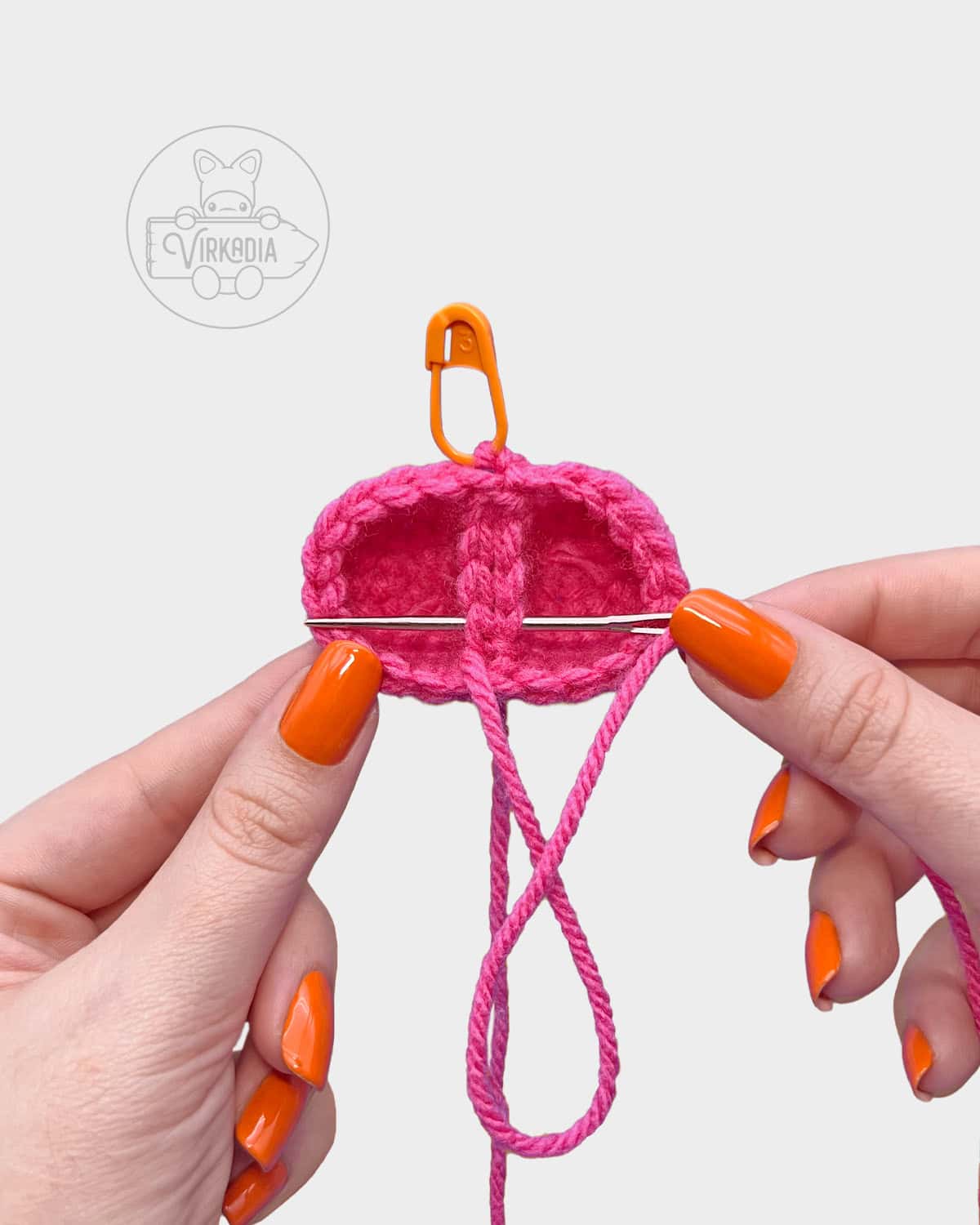 free crochet heart keychain tutorial of how to sew the pieces together