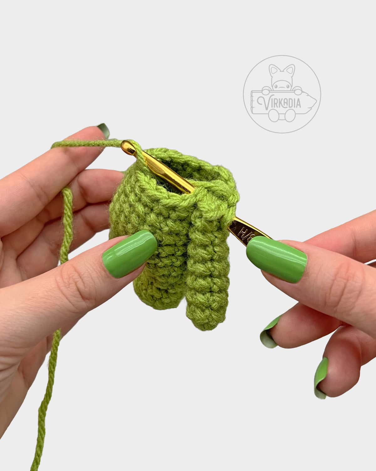 free Little Crochet Guy doll tutorial of how to attach the arms onto the body without sewing