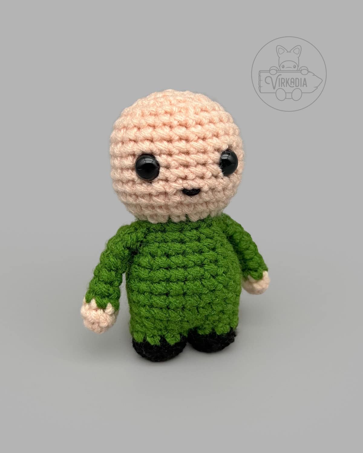 free Little Crochet Guy pattern with a green body for DIY doll making, seasonal amigurumi projects, and holiday gifts