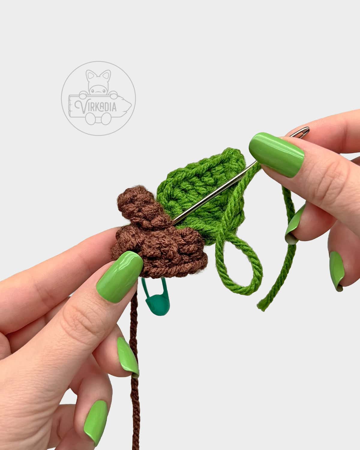 free Little Acorn Guy crochet doll tutorial of how to sew the leaf onto the acorn cap